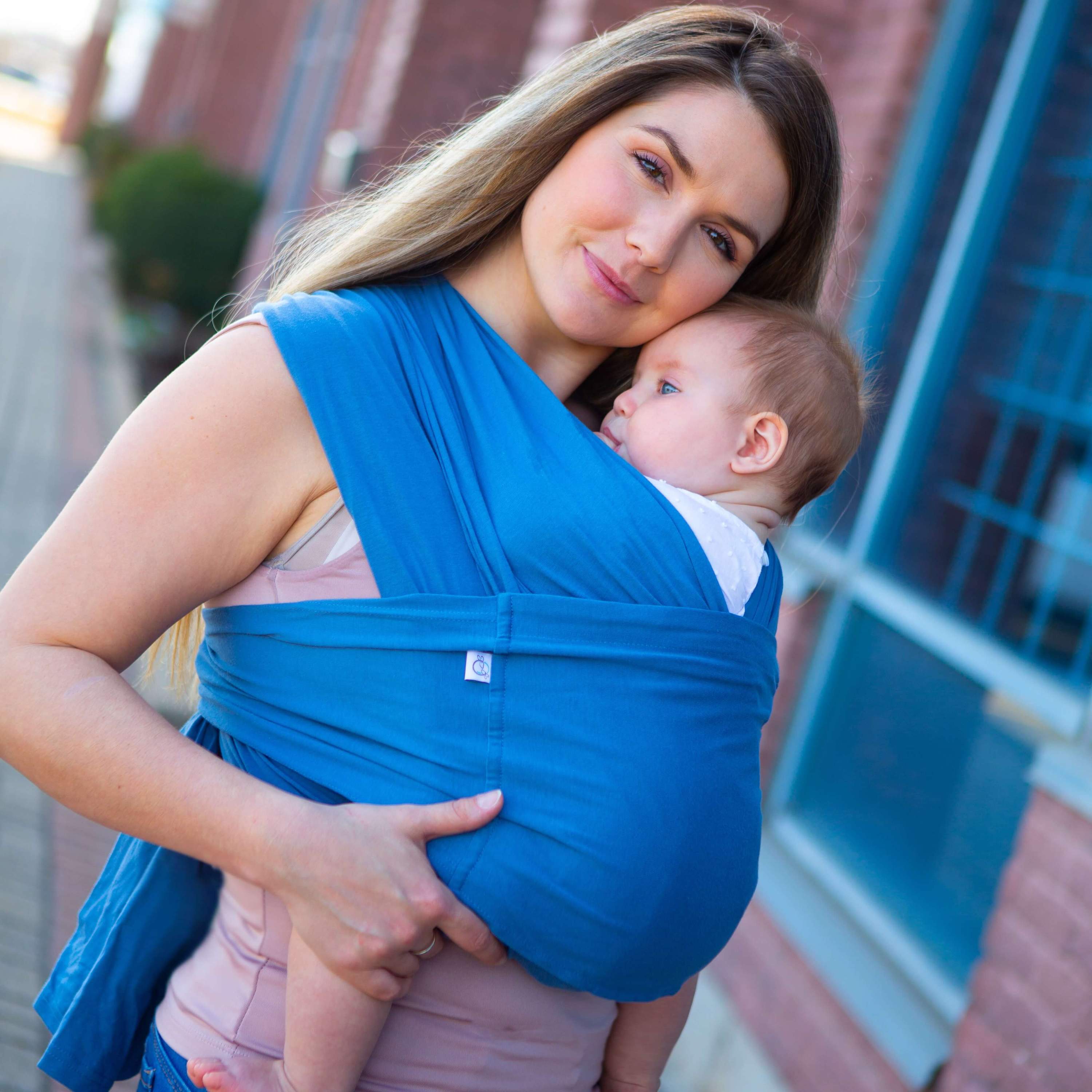 Amber Leto Snüg baby clothing in snug blue fabric, soft and cozy for infants, shown in this close-up image.