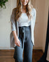 Elegant blouse from Start2Finish, featuring a stylish design, paired with optional accessories on a plain background.