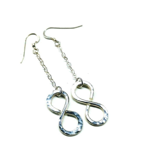Sterling silver infinity earrings with hammer pattern by Blue Crius, featuring a sleek and modern jewelry design.