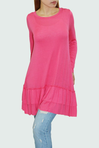 Yellow Hera long sleeve pleated bottom coral tunic dress displayed on a hanger, showcasing its flowing fabric and stylish design.