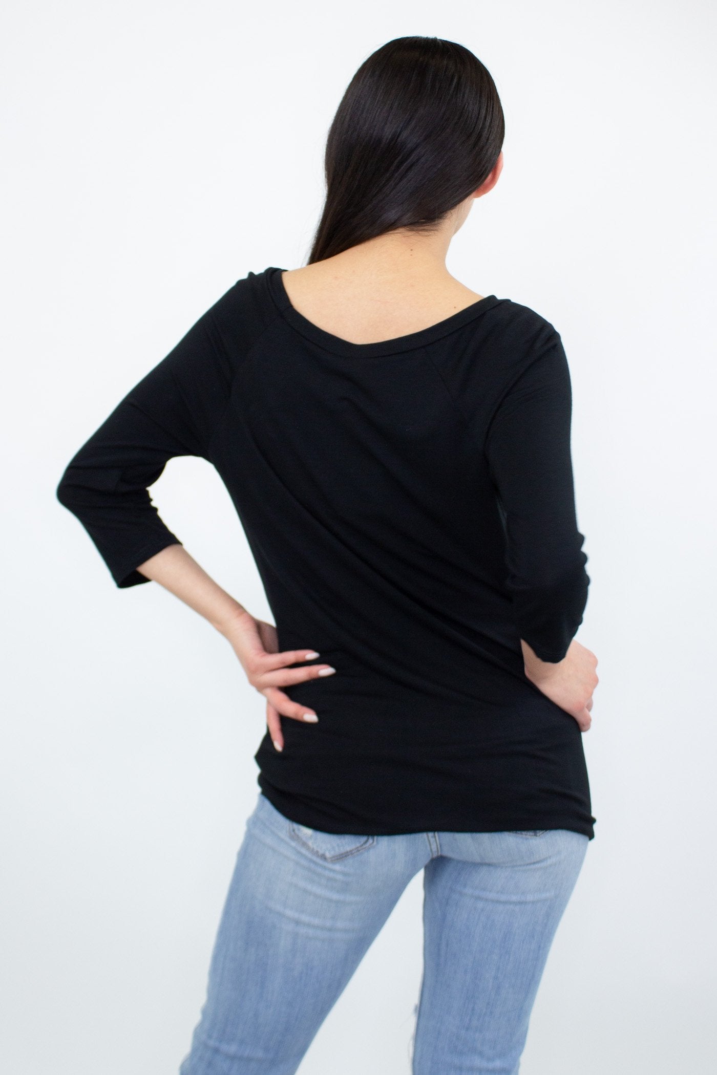 Black twisted front comfortable top by Yellow Hera, shown on a model, featuring a stylish twisted design and casual fit.