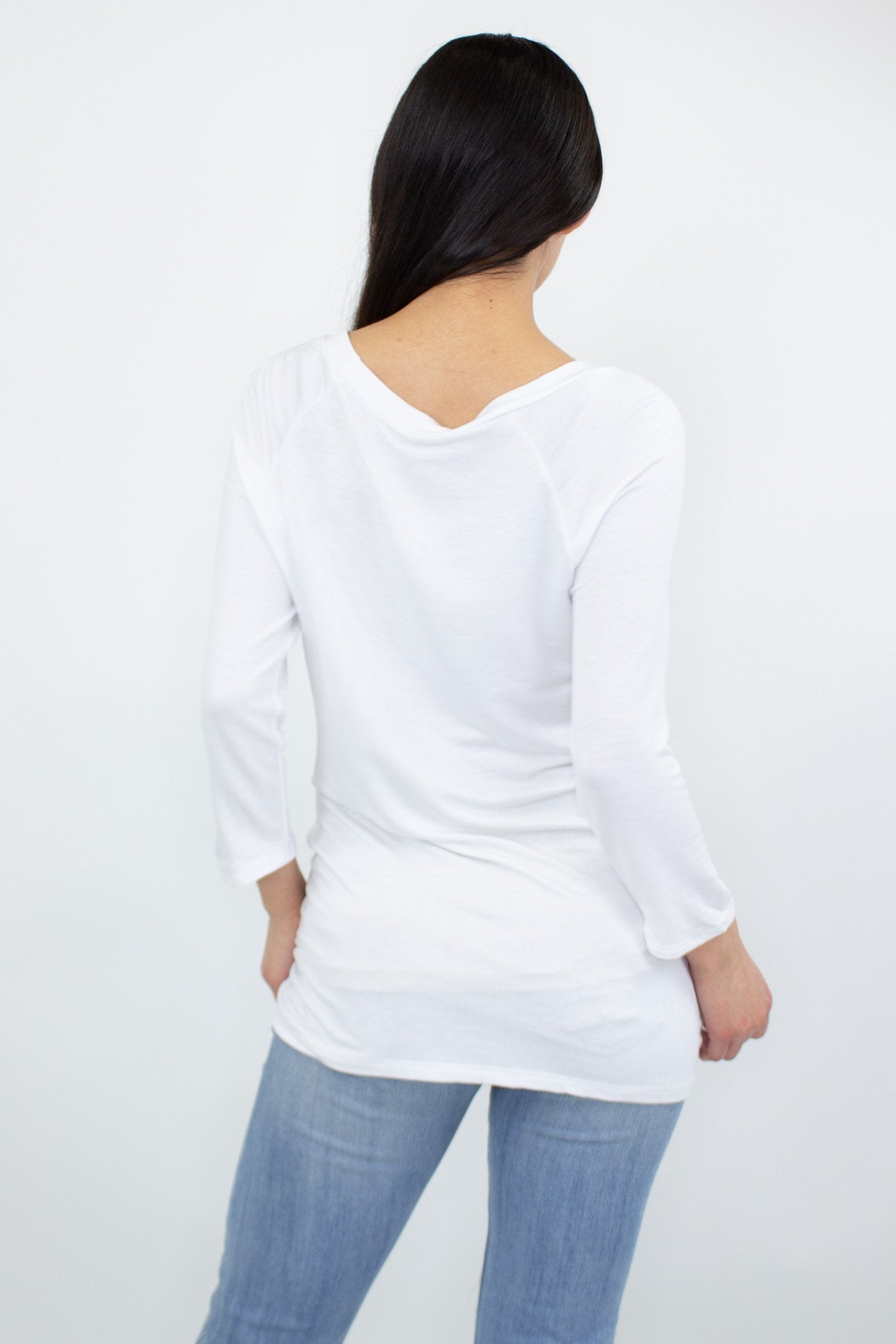 White Twisted Front Comfortable Top by Yellow Hera, showcasing a stylish design on a casual clothing piece.