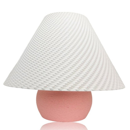 Pink Aurora Weave portable table lamp by Azure Pontus with a woven design and soft glowing light.