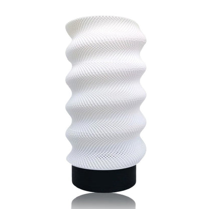 Black Lumina Twist portable table lamp by Azure Pontus with a sleek, modern design perfect for ambient lighting.