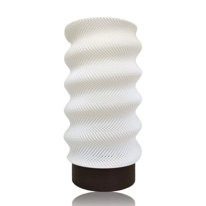 Azure Pontus Lumina Twist table lamp with a brown lighting fixture featuring a modern, twisted design.