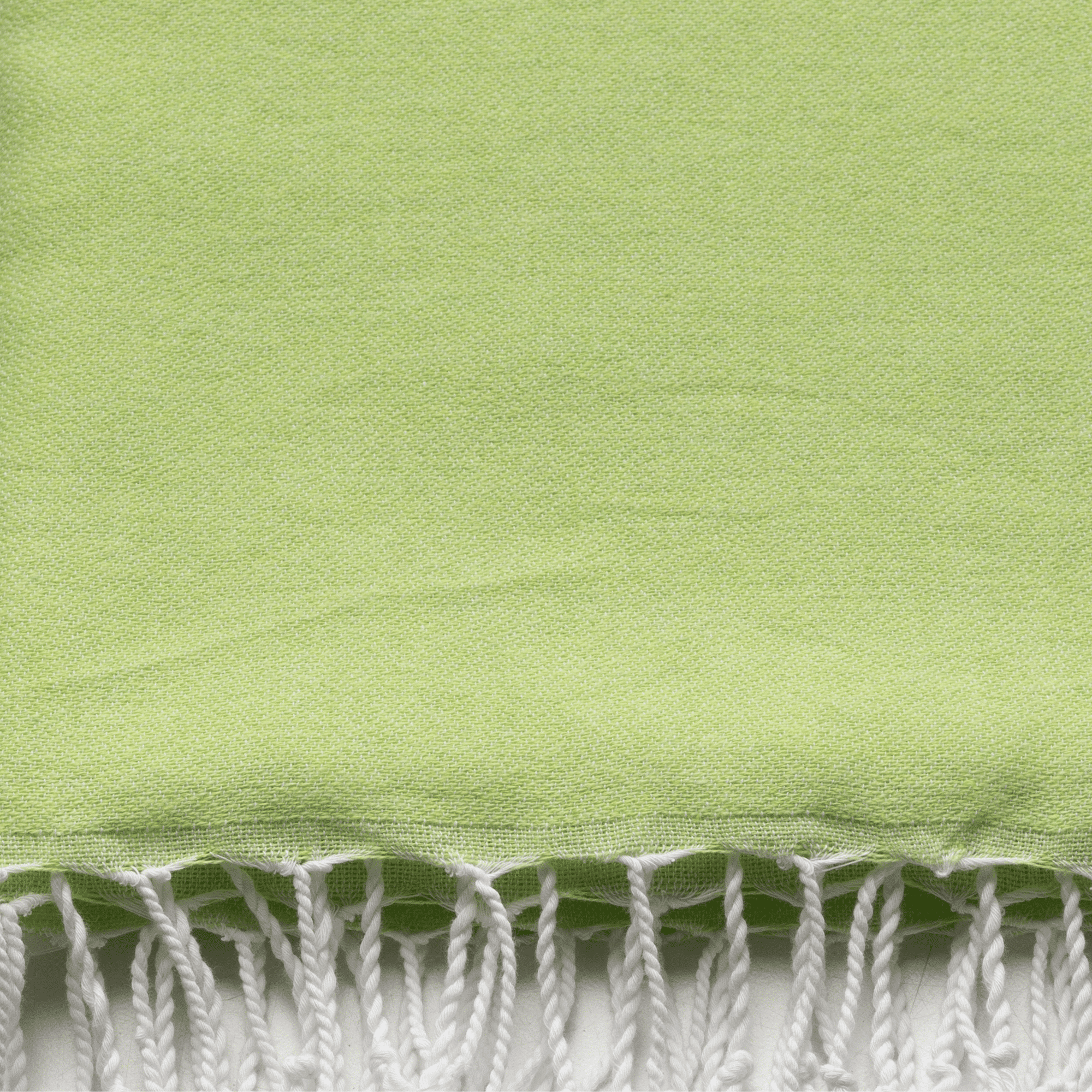 Neon mint and lime 2-in-1 hammam towel bag made of recycled cotton by Copper Amymone, showcasing vibrant colors and compact design.