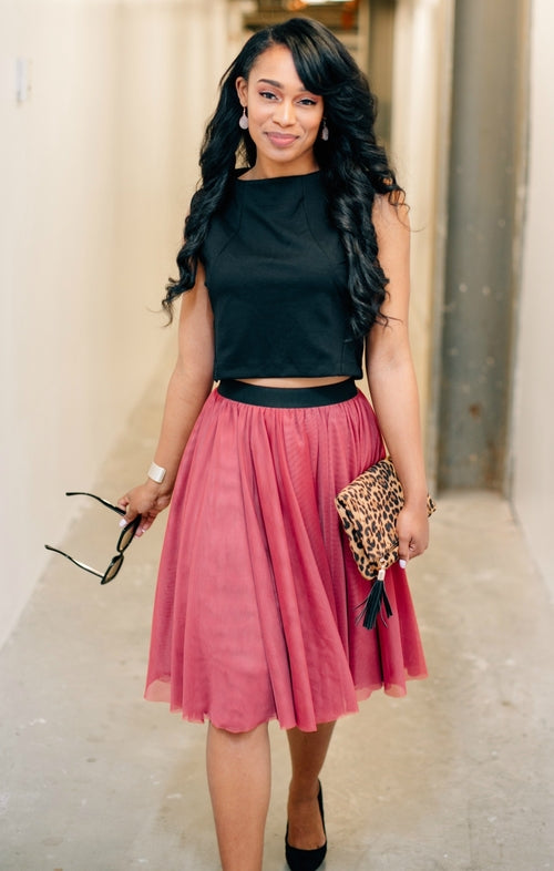 Salmon Bella Sweet Pea skirt in soft fabric with a floral pattern, shown on a model with a flowy, knee-length design.