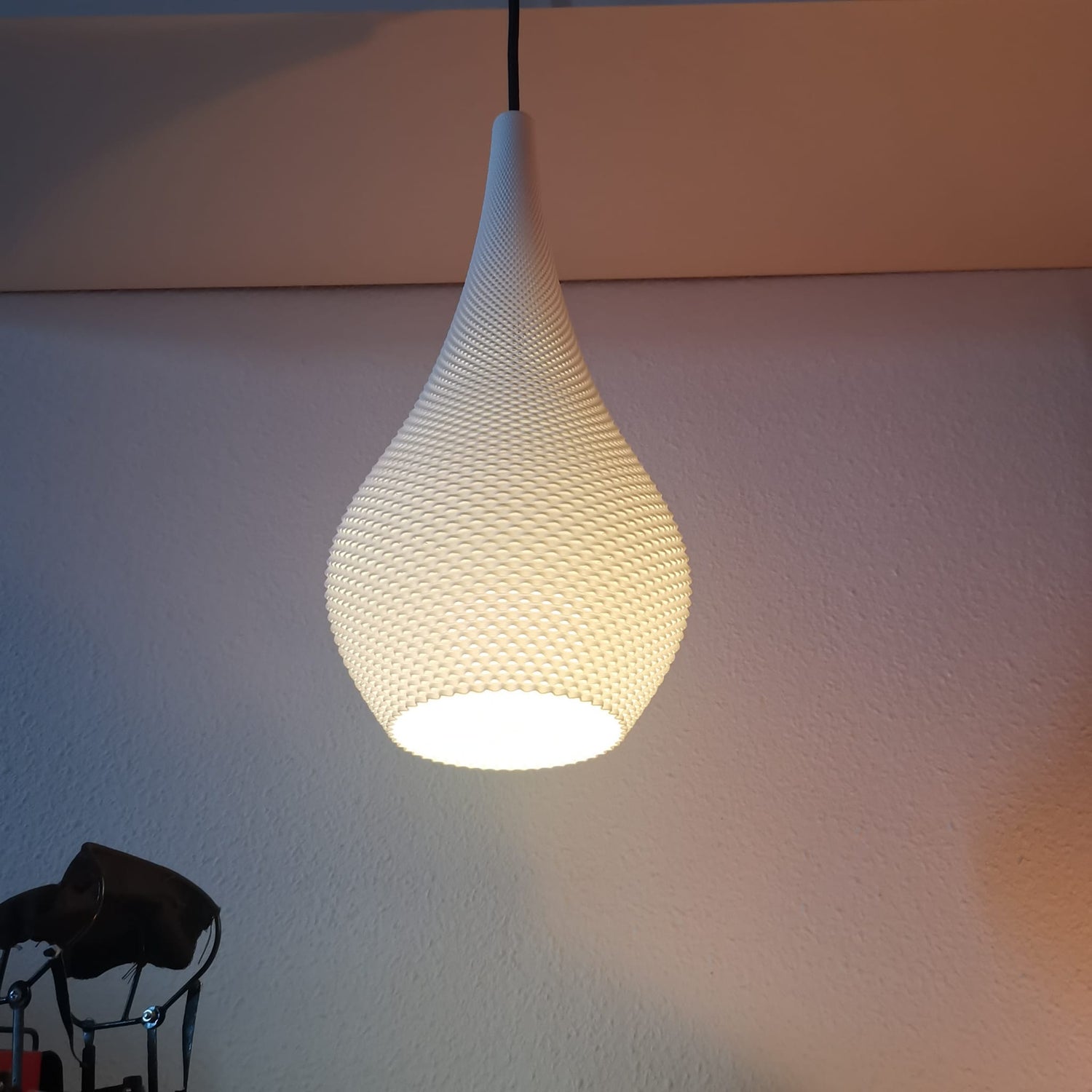 Azure Pontus Teardrop Edition pendant lamp hanging from ceiling with smooth glass teardrop shape and modern lighting design
