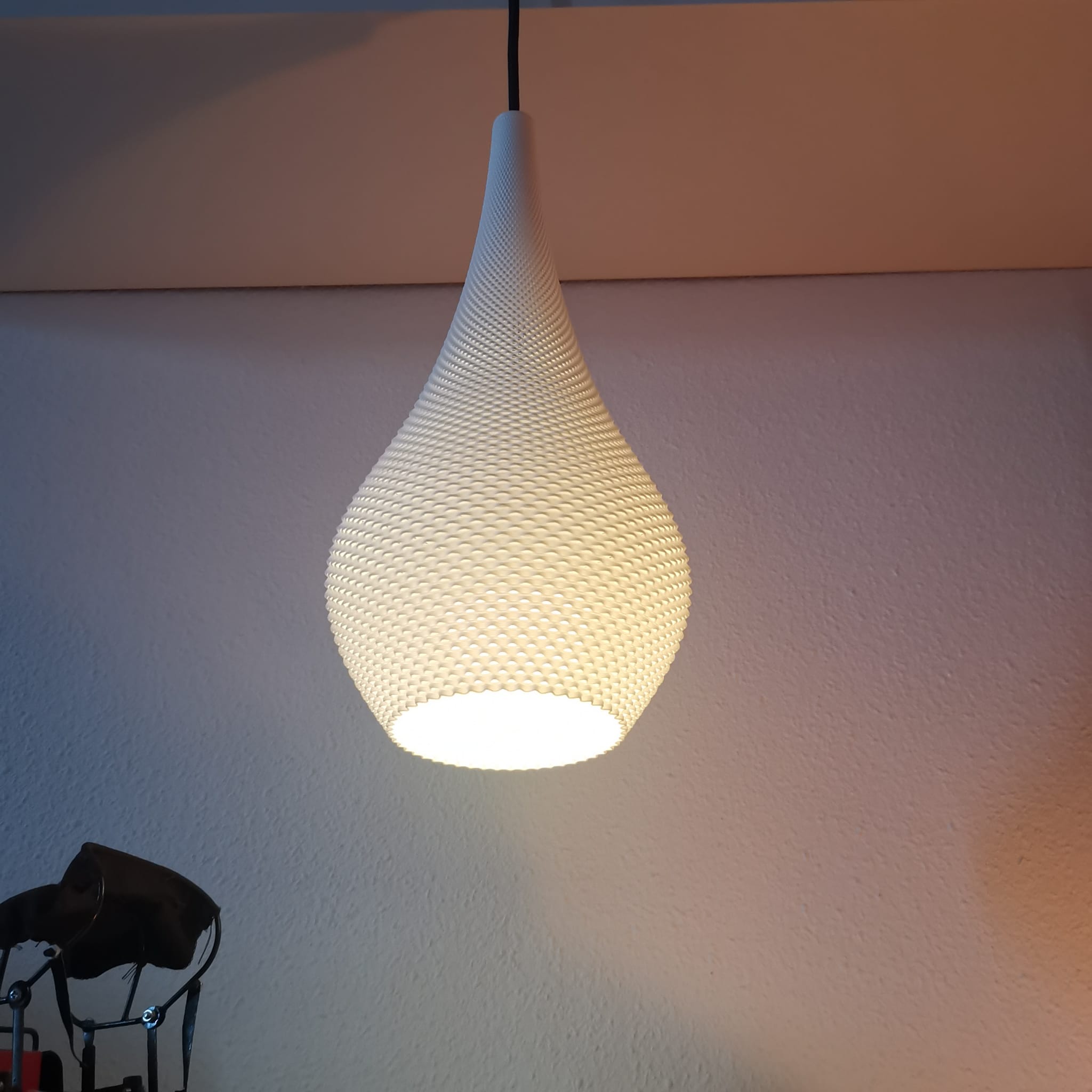 Azure Pontus Teardrop Edition pendant lamp hanging from ceiling with smooth glass teardrop shape and modern lighting design