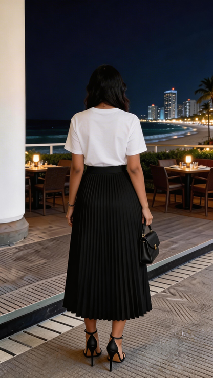 Fuchsia Erebus handbag featuring a sleek design, paired with a chic two-piece T-shirt and pleated silky skirt ensemble.