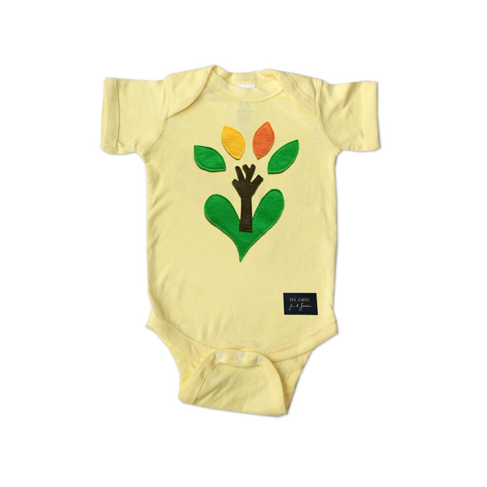 Yellow onesie for babies from Sky Blue Milo featuring a tree design, suitable for boys, in a close-up view.