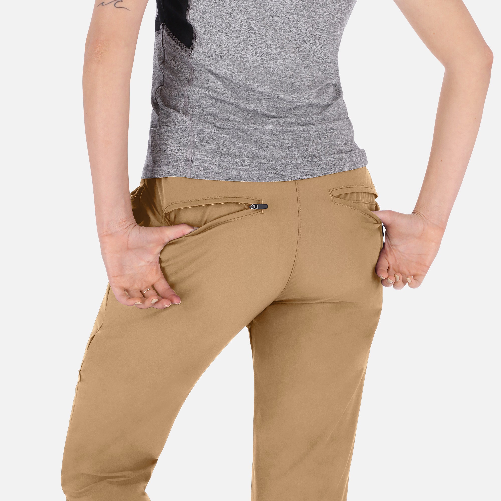 Women’s beige adventure activewear pants by Rose Hemera, full-length trousers with a comfortable fit and functional design.