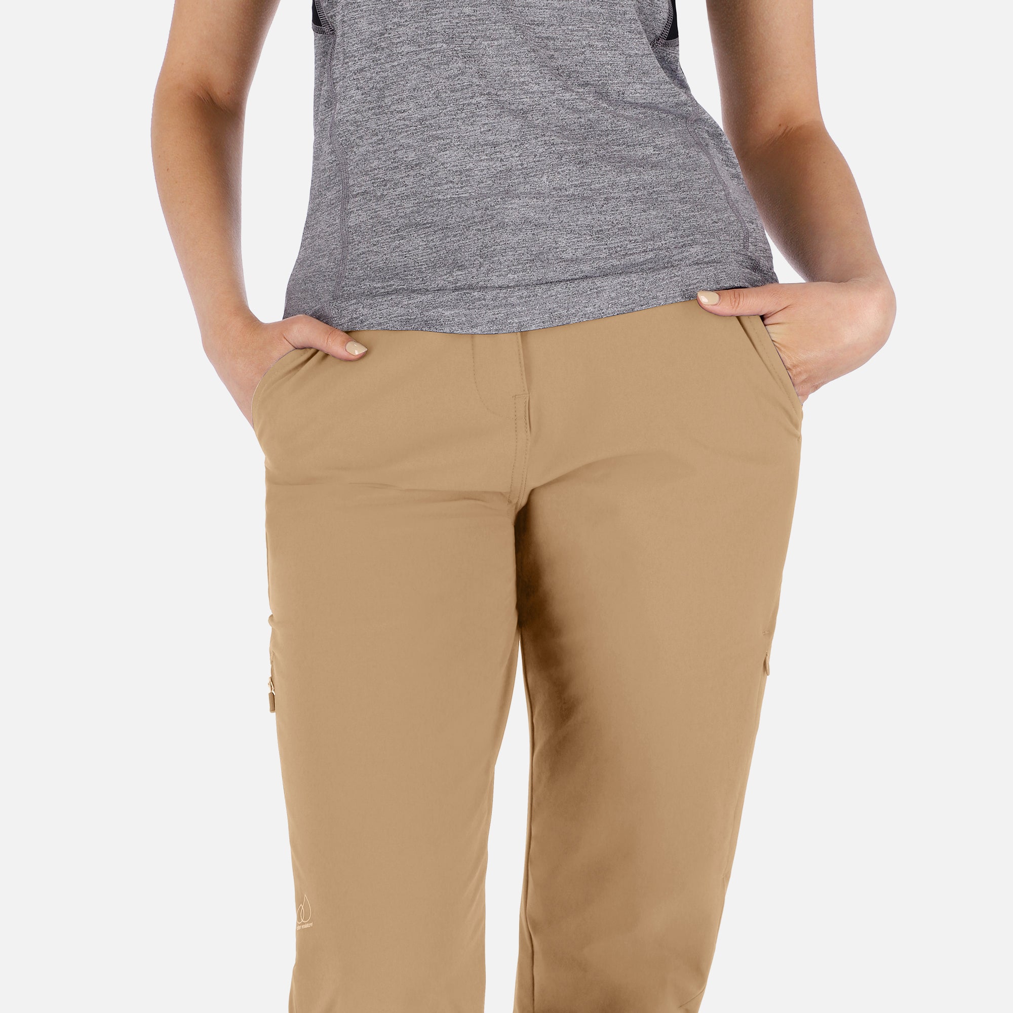 Women’s beige adventure pants by Rose Hemera, activewear trousers with a relaxed fit and functional design for outdoor activities.
