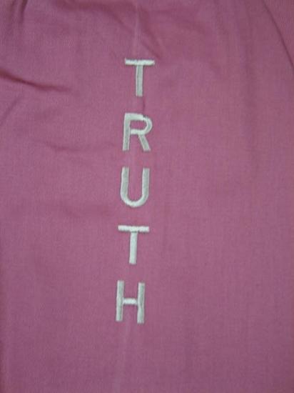 Alabaster OMSutra Yoga Bag with slogan print, designed for carrying yoga mats and accessories, in the image with a bright background.