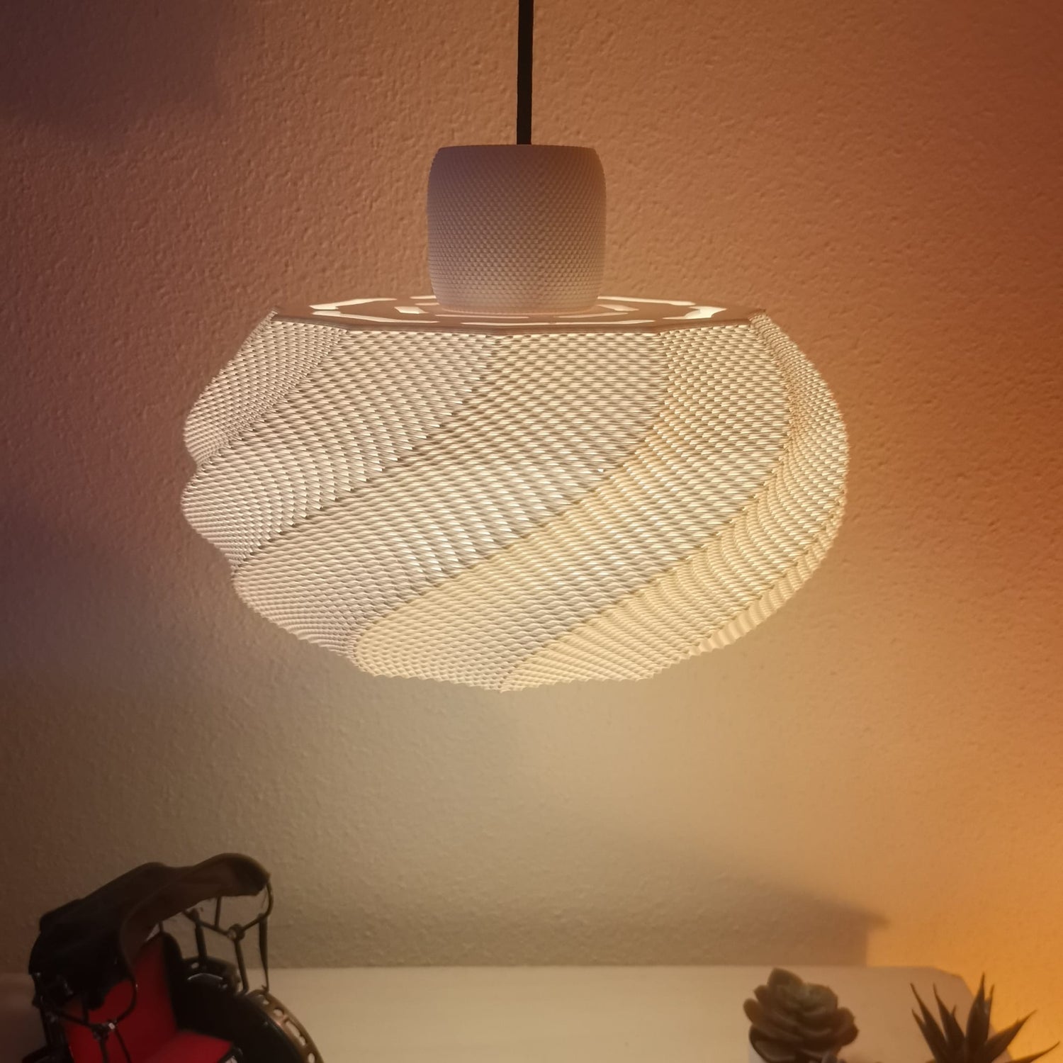 Azure Pontus Twist Glow Pendant Lamp hanging with a modern design, featuring a twisting illuminated glass shade for stylish lighting.