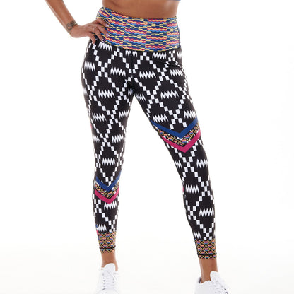 White Oliver Kayentee Cerulean Splash activewear leggings with vibrant blue and green abstract print, close-up view of the fabric pattern