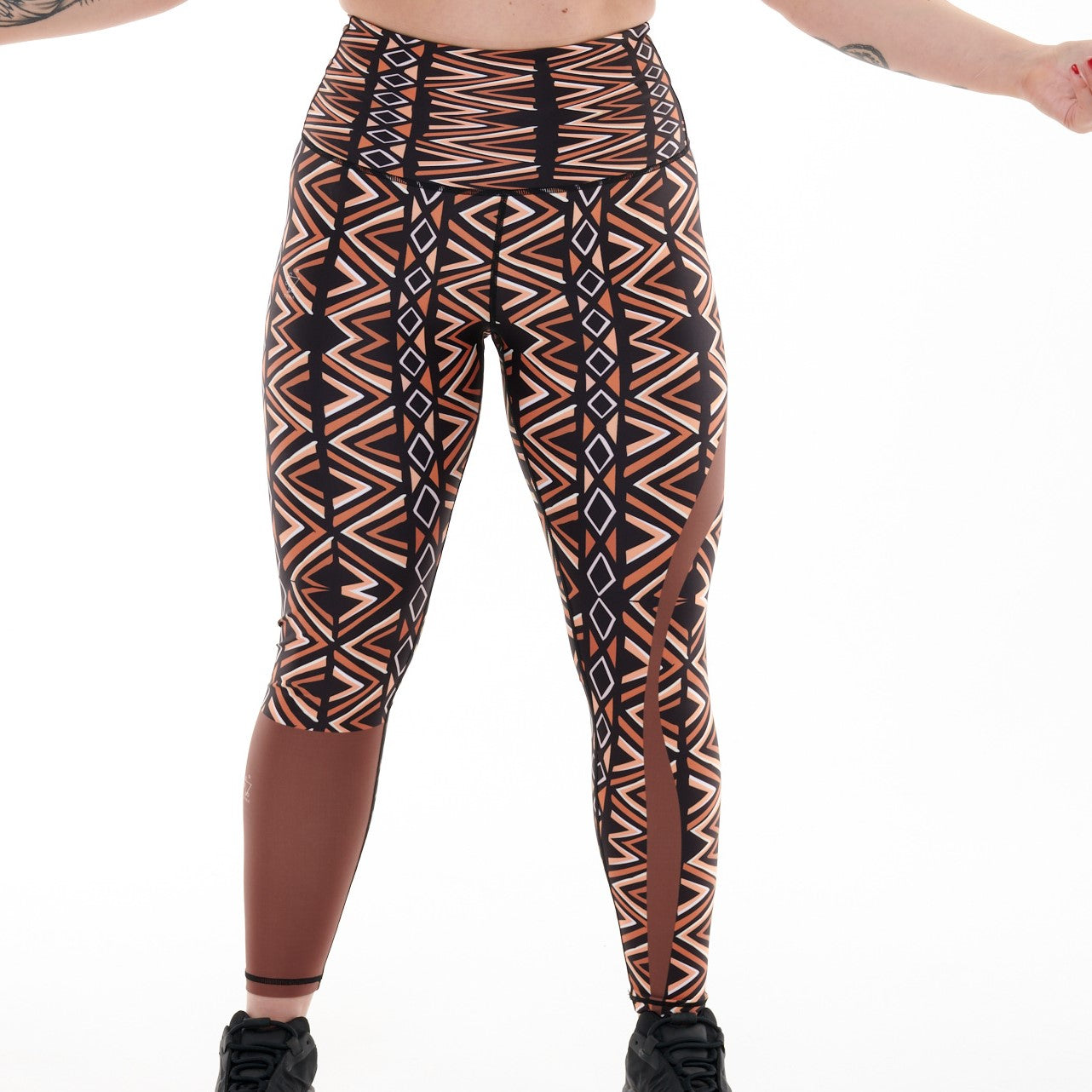 Close-up of Ibeekay Vibrant Leggings by White Oliver showcasing colorful, stretchy activewear fabric with a textured pattern.