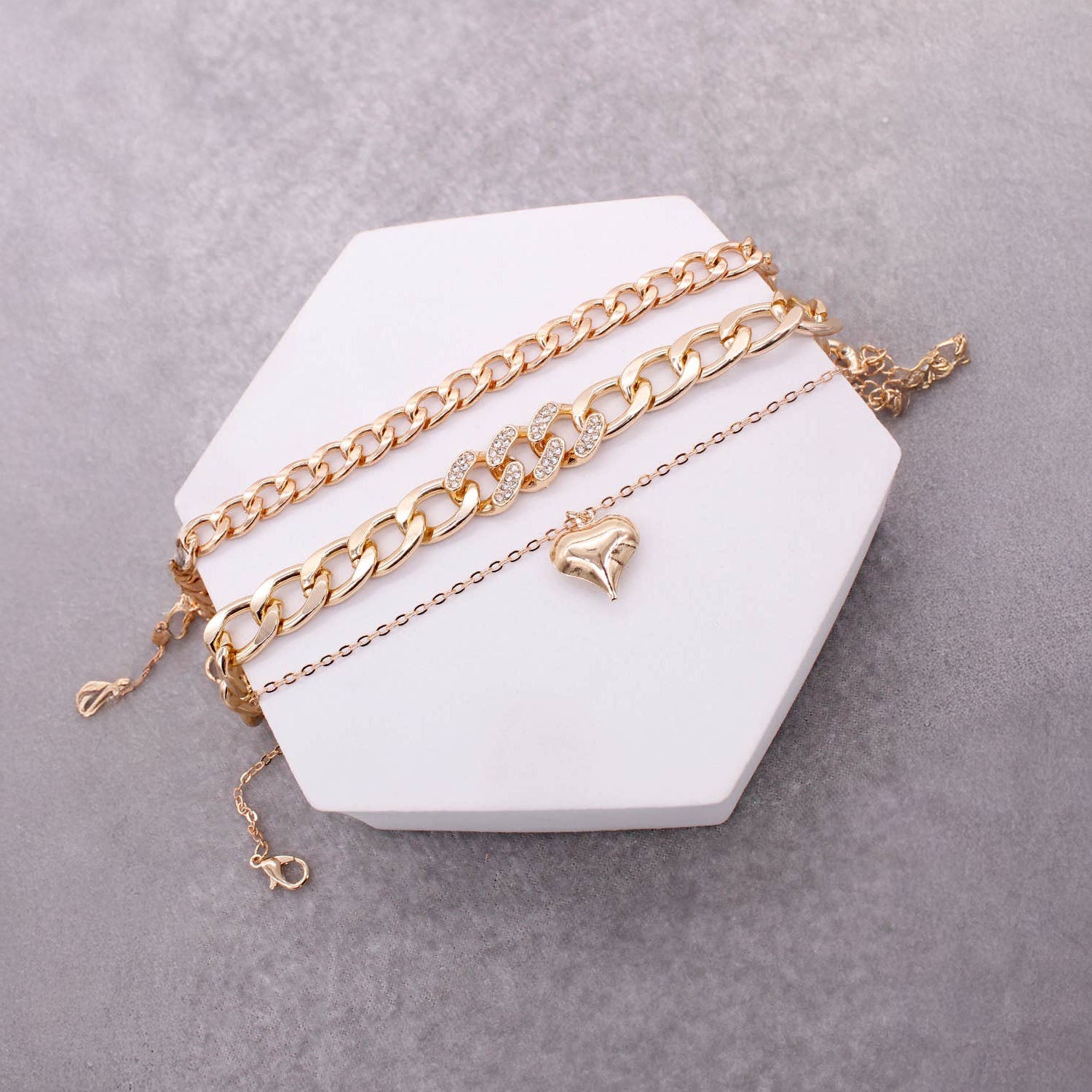 Lavender Tartarus 3 assorted heart pendant chain bracelet set featuring delicate jewelry accessories for women.