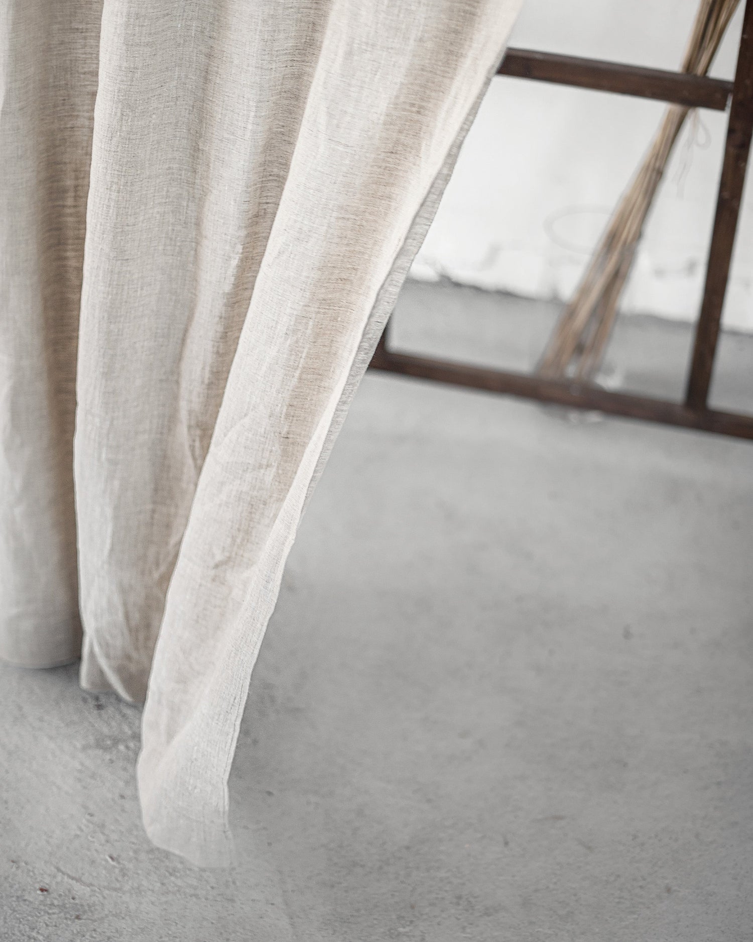 Grey linen curtain with rod pocket from Magenta Sugarplum, hanging on a curtain rod in a home decor setting.