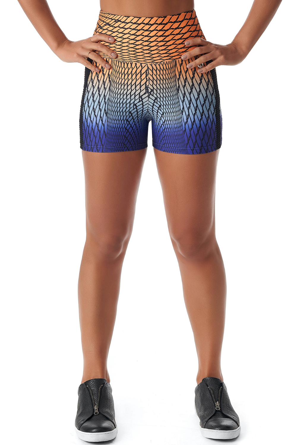 Red Medusa Spiral Booty Shorts in activewear, featuring a stylish spiral design and form-fitting fit for workout and casual wear.