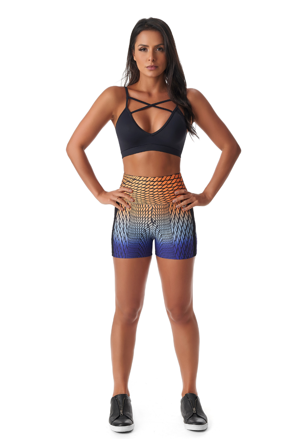 Red Medusa Spiral Booty Shorts in vibrant activewear with a spiral design, showcasing a form-fitting, stretchy fabric for workout comfort.