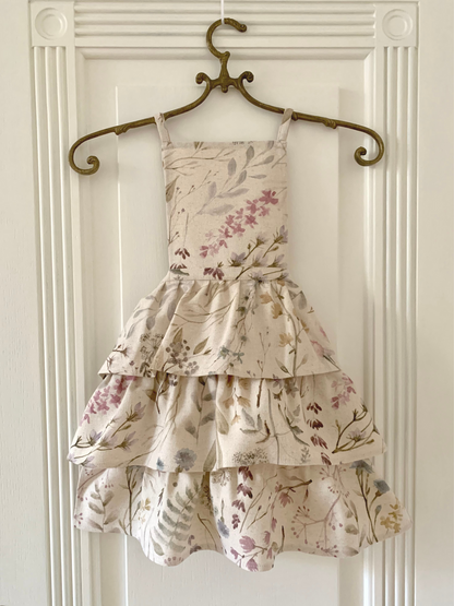 Kids’ linen-cotton mix apron with ruffles and printed design by Rose Trillium, perfect for playful home decor.