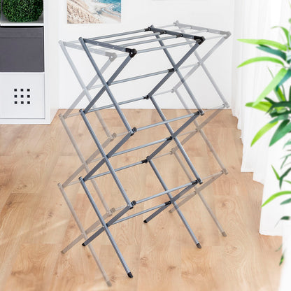 Extendable metal clothes dryer with 3 levels, compact foldable design for home laundry storage, by Bigbuy.