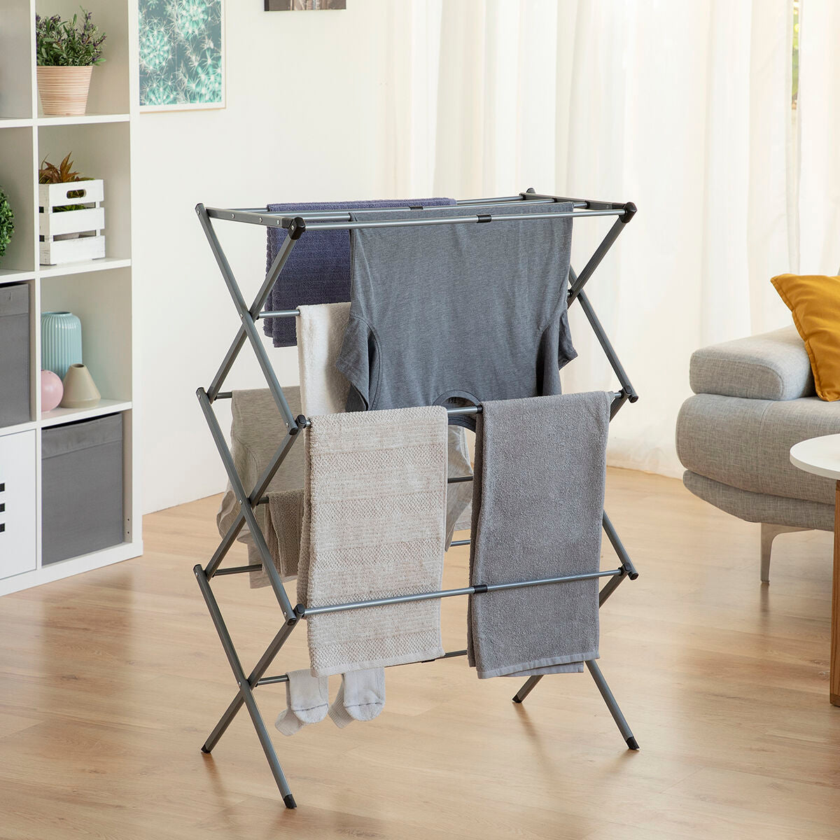 Three-level metal folding clothes dryer by Bigbuy, extendable and compact for home laundry drying.