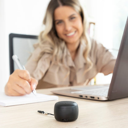 Rechargeable portable wireless mini speaker from Miund InnovaGoods, compact consumer electronics device with buttons and speaker grille.