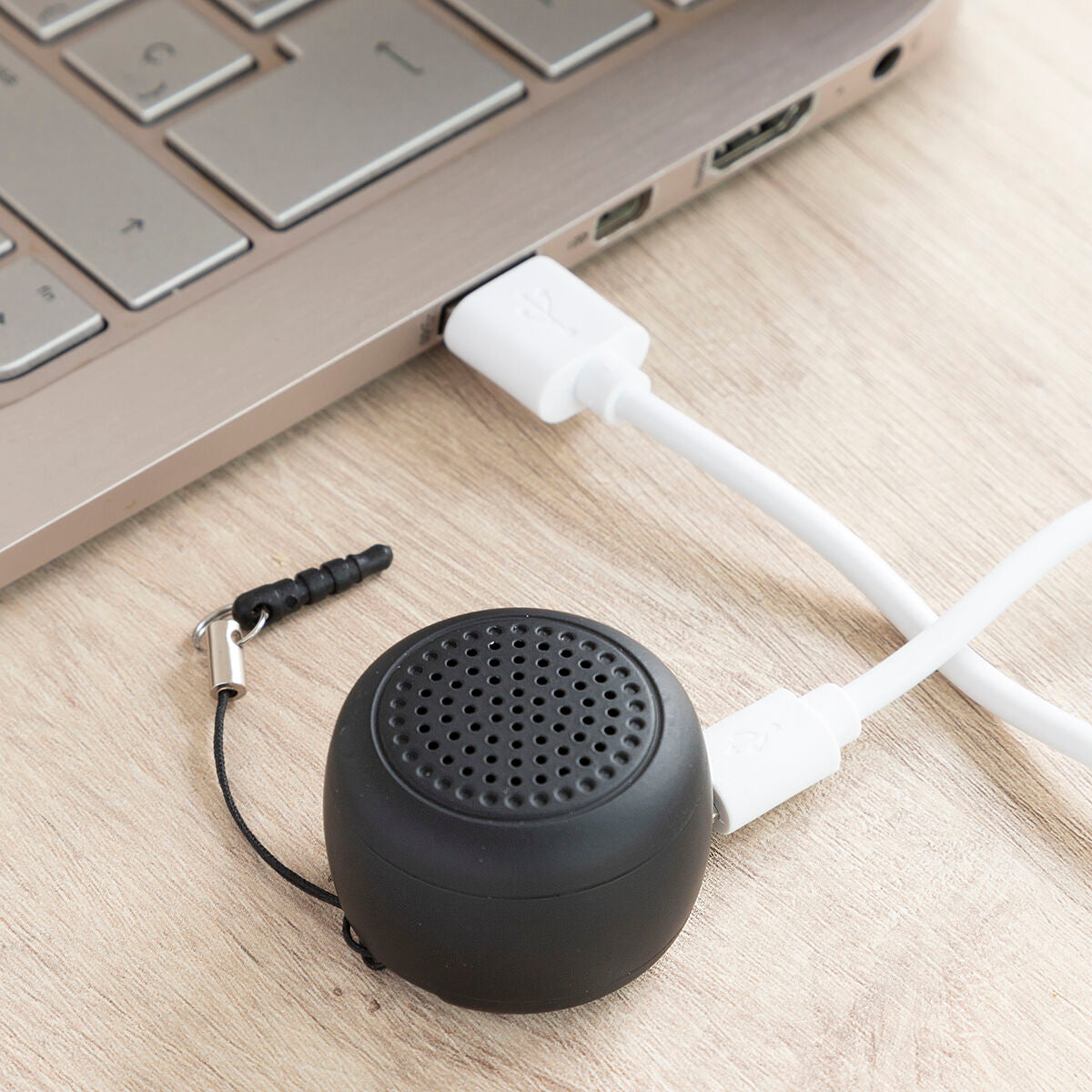 Rechargeable portable wireless mini speaker by Miund InnovaGoods, compact consumer electronics with built-in rechargeable battery.