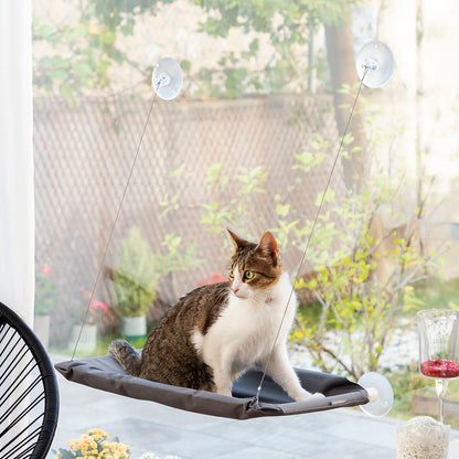 Hanging Cat Hammock by Bigbuy, designed for pets, showing a cozy fabric hammock with a cat lounging inside.