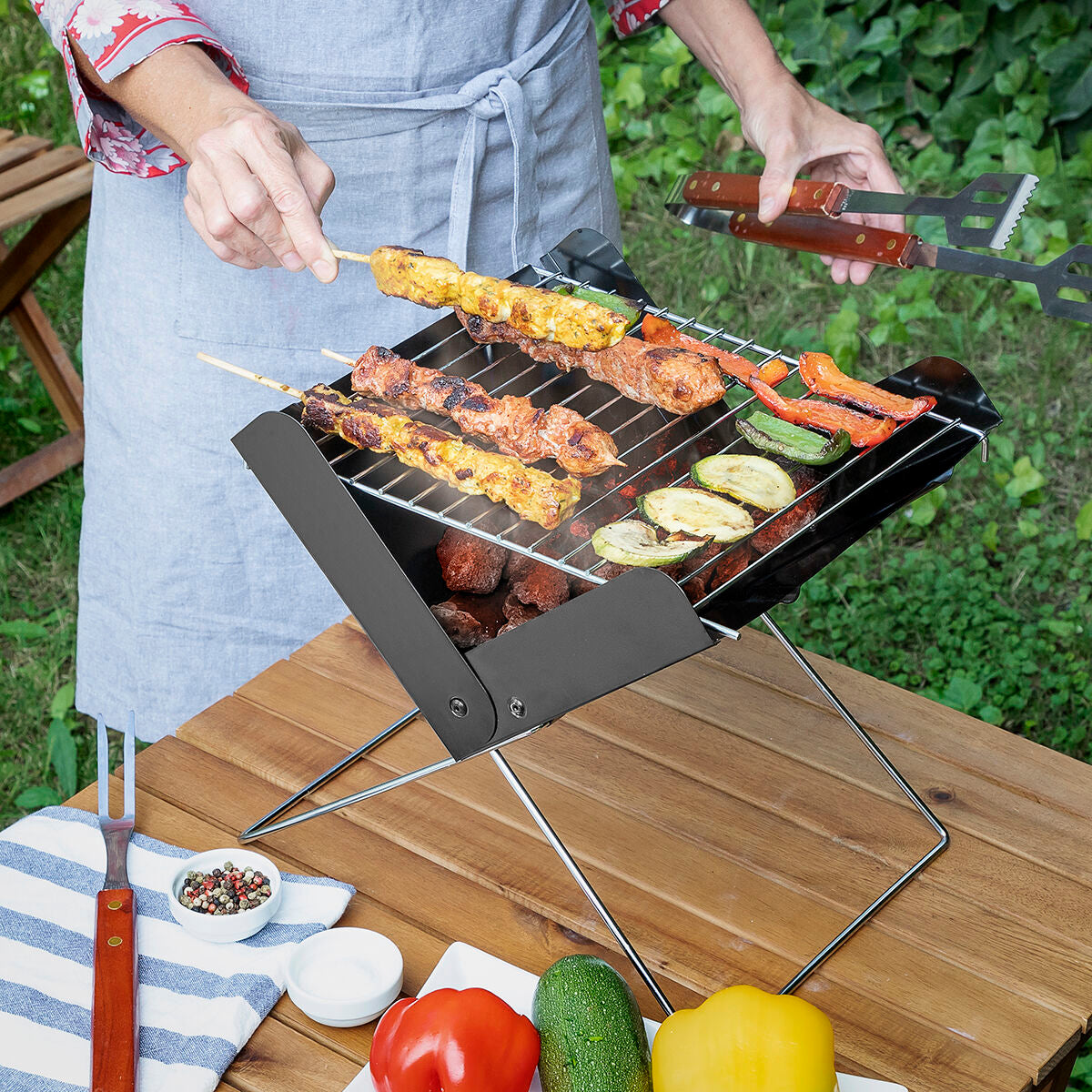 Portable charcoal mini folding barbecue for garden use by Bigbuy, with compact design and foldable legs for easy transport.