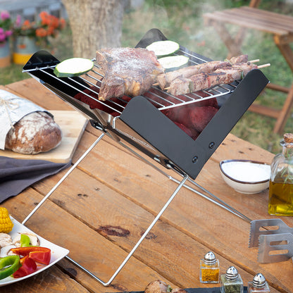 Portable folding charcoal barbecue in compact garden design by Bigbuy, perfect for outdoor grilling and easy transport.