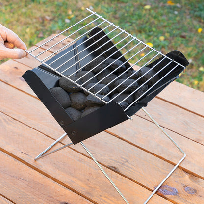 Bigbuy Foldecue InnovaGoods mini folding portable charcoal barbecue for outdoor garden cooking, compact and easy to carry.