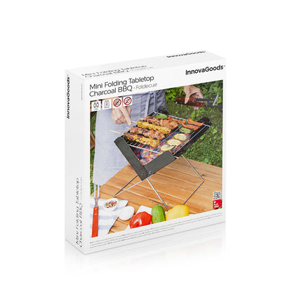 Small portable charcoal barbecue by Bigbuy for outdoor garden use, featuring a foldable design for easy transport and storage.