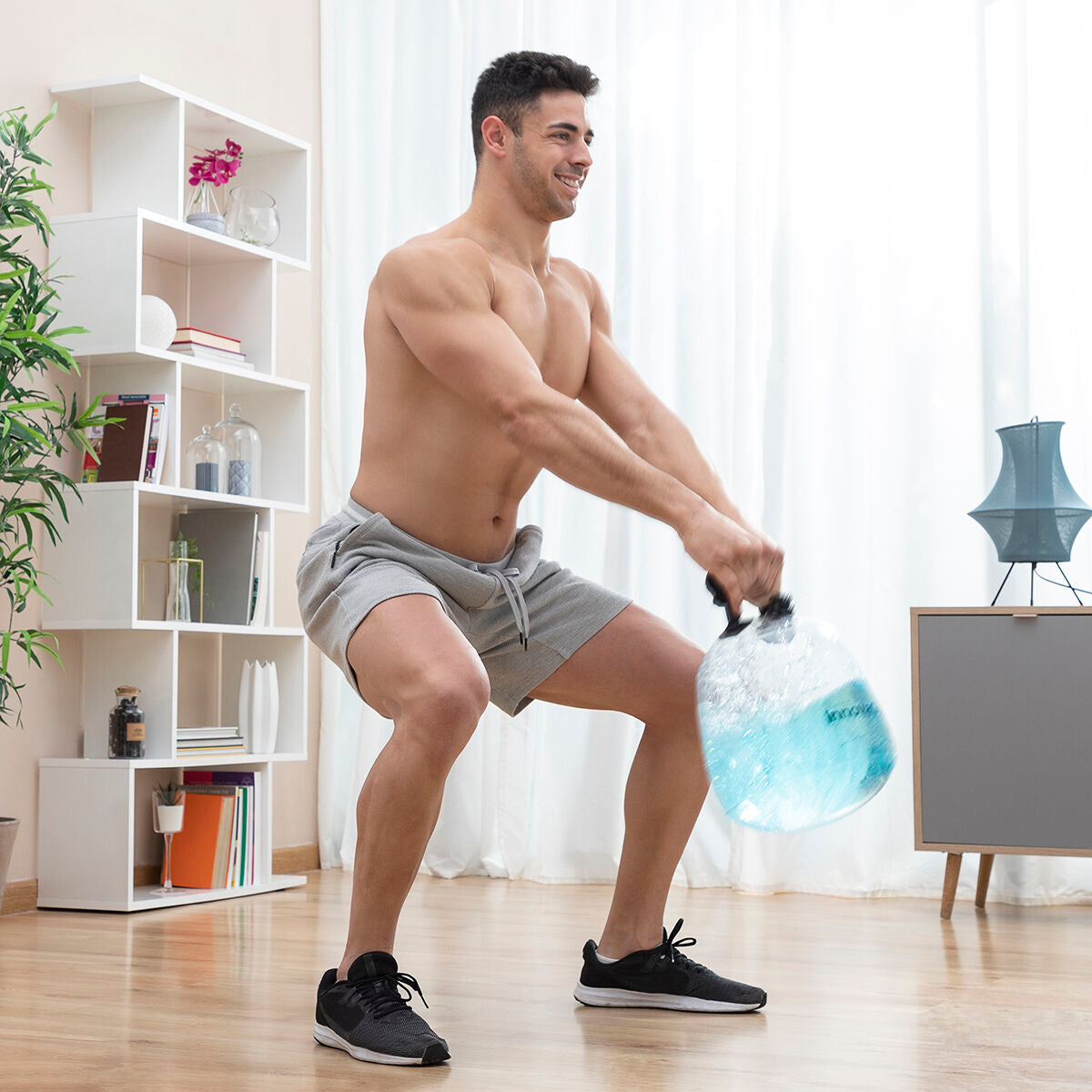 Bigbuy water-filled kettle bell for fitness training with exercise guide, showing the durable, water-filled weight and workout instructions.