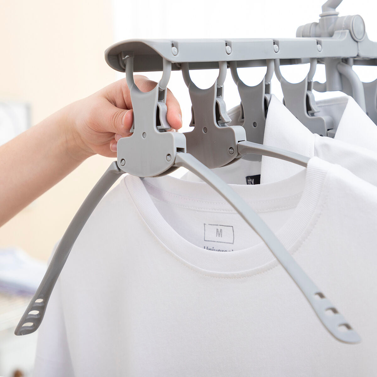 Multi-functional 8-in-1 hanger by InnovaGoods, featuring various hooks and compartments for versatile clothing and accessory organization.
