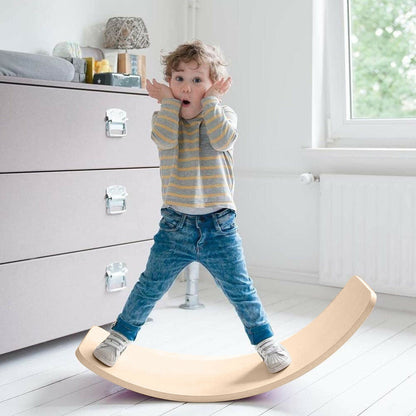 Wooden balance board beam seesaw for kids and adults, used for yoga and balance exercises, by Ultramarine Dione.