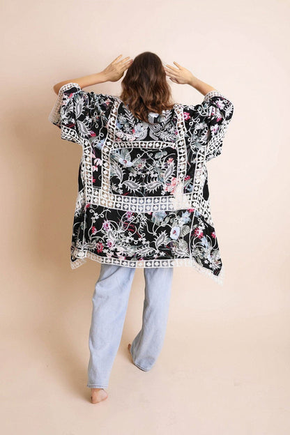 Heirloom embroidered kimono accessory by Periwinkle Aether with intricate floral embroidery and flowing fabric.