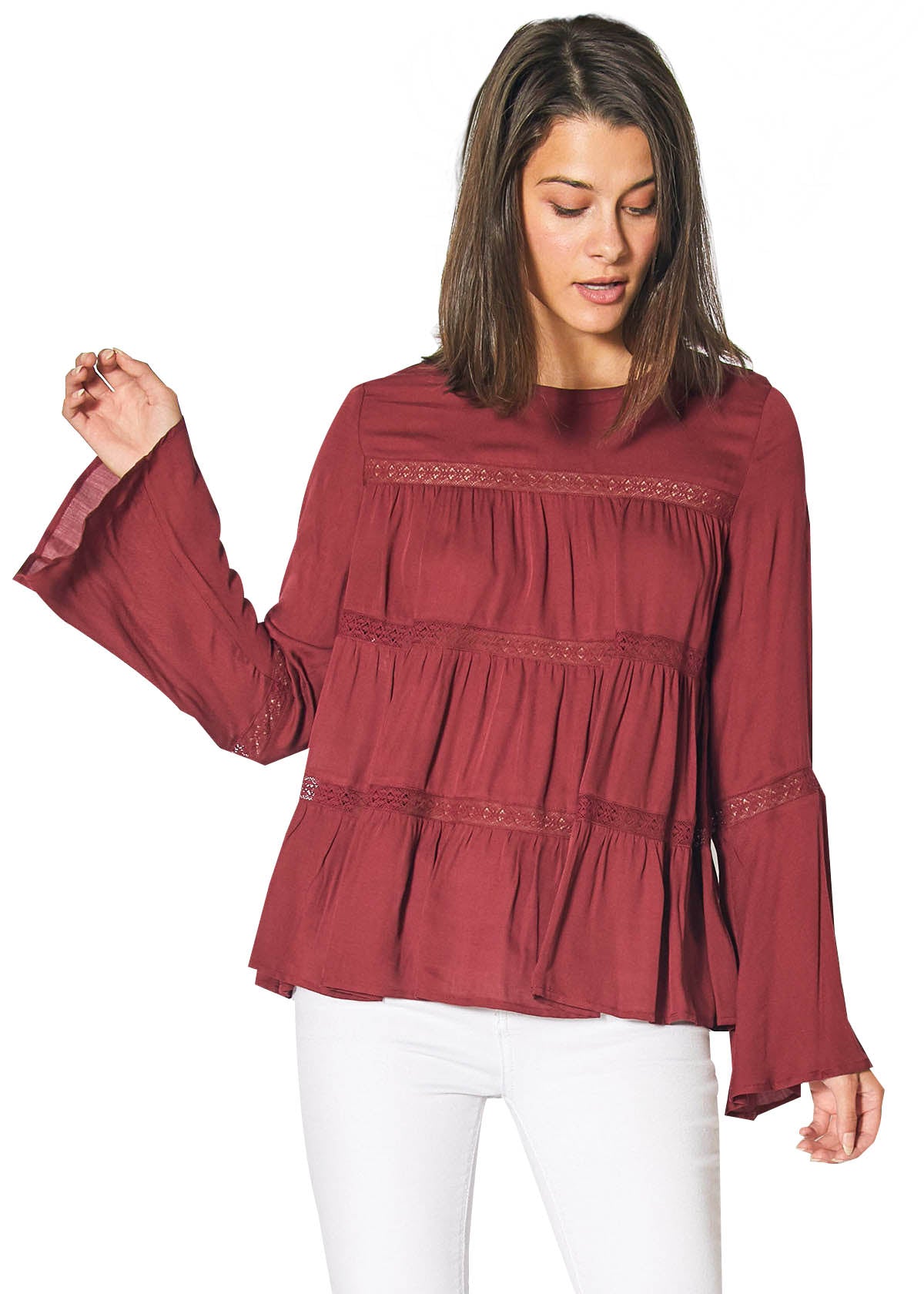 Red cordovan bell sleeve tiered blouse by Lemon Hera, showcasing flowing fabric and stylish layered design.