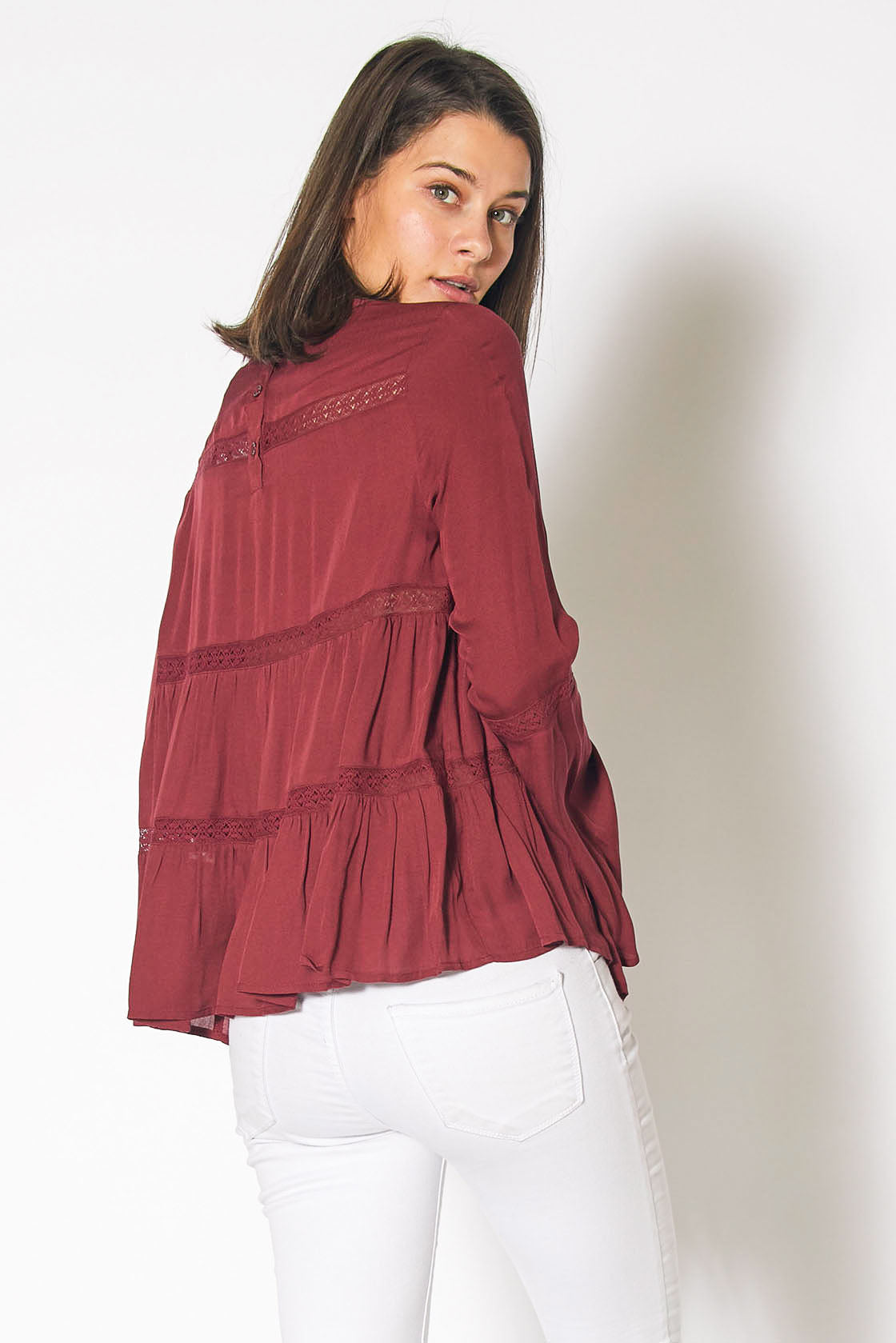 Red cordovan bell sleeve tiered blouse by Lemon Hera, featuring flowing fabric and stylish bell sleeves, perfect for casual or dressy wear.