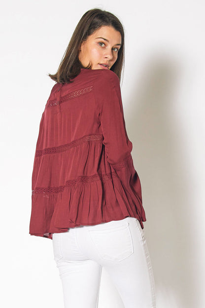 Red cordovan bell sleeve tiered blouse by Lemon Hera, featuring flowing fabric and stylish bell sleeves, perfect for casual or dressy wear.