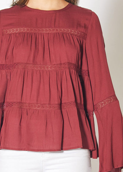 Red Cordovan bell sleeve tiered blouse by Lemon Hera, featuring ruffled bell sleeves and a layered design, perfect for stylish outfits.