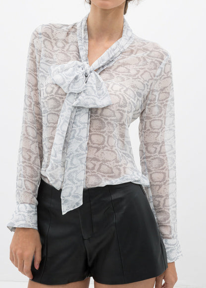 Ivory silver tie neck sheer blouse by Lemon Hera, featuring delicate fabric and elegant design, ideal for stylish tops and blouses.