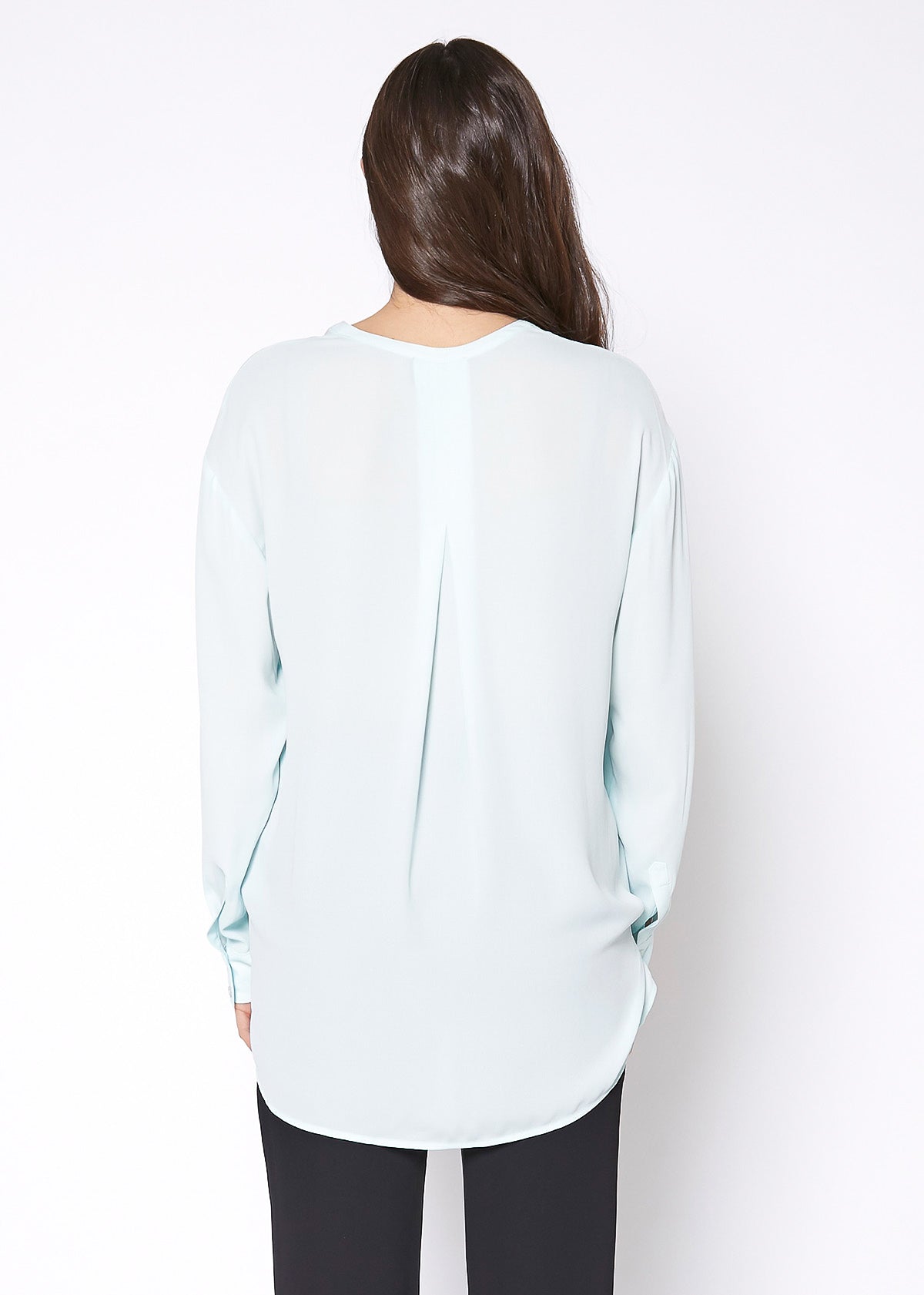Lemon Hera V-neck wrap hem blouse in peppermint green, featuring a stylish fit and a flattering V-neck design.