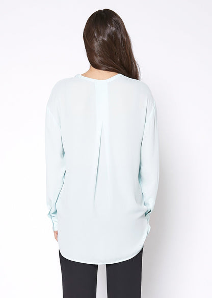 Lemon Hera V-neck wrap hem blouse in peppermint green, featuring a stylish fit and a flattering V-neck design.