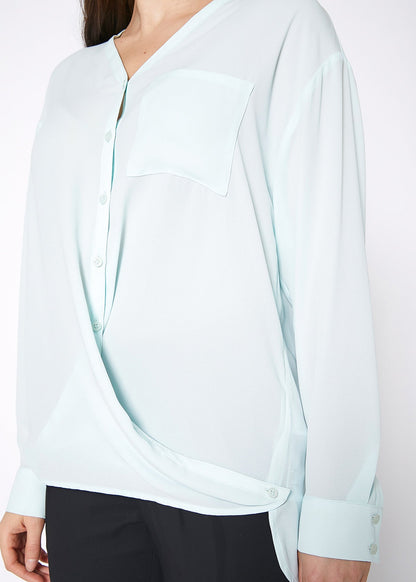 Lemon Hera V-neck wrap hem blouse in peppermint green, featuring a stylish V-neck and flowy long sleeves.