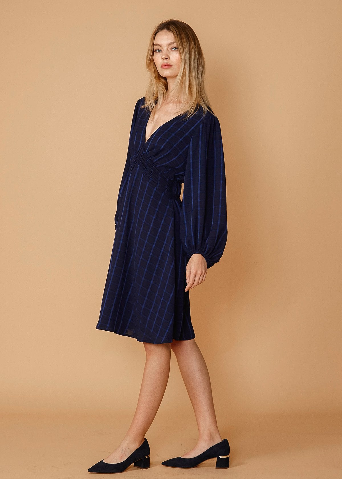 V-neck checkered dress in night plaid by Lemon Hera, showcasing the stylish pattern and fit of the dress.