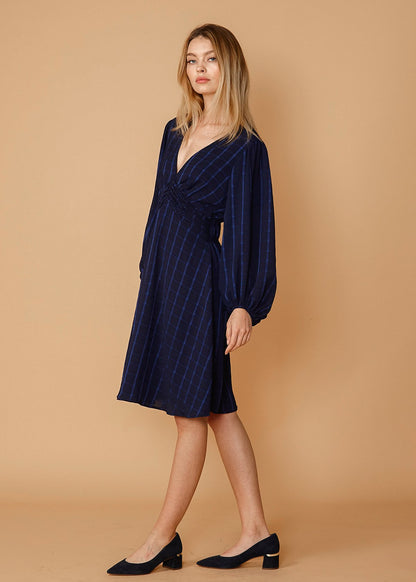 V-neck checkered dress in night plaid by Lemon Hera, showcasing the stylish pattern and fit of the dress.