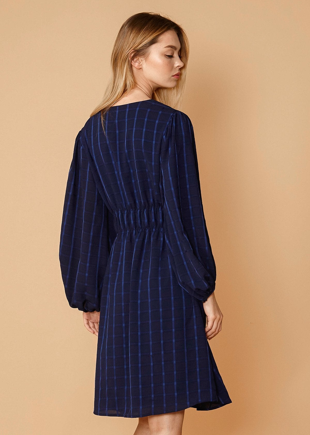 V-neck checkered dress in night plaid by Lemon Hera, featuring a stylish V-neckline and classic checkered pattern.